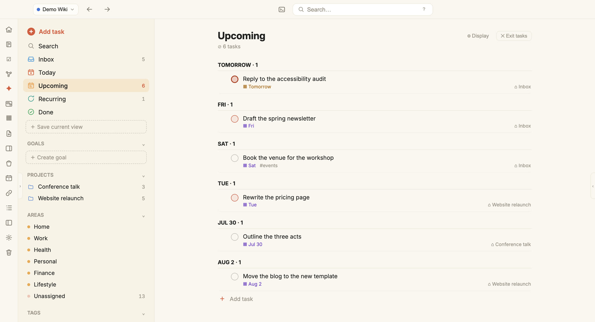 MojoPad's task view showing upcoming work grouped by day, each task with its due date, tag, and the project or inbox it came from